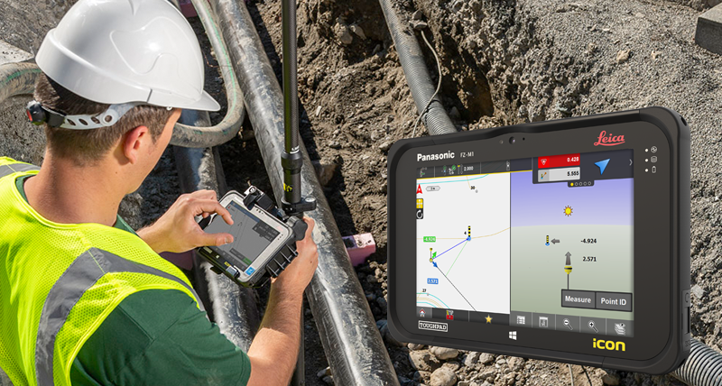 Un ouvrier en gilet de sécurité jaune mesure des points avec une Leica iCON GPS 30 et un contrôleur de terrain Leica iCON CC70.