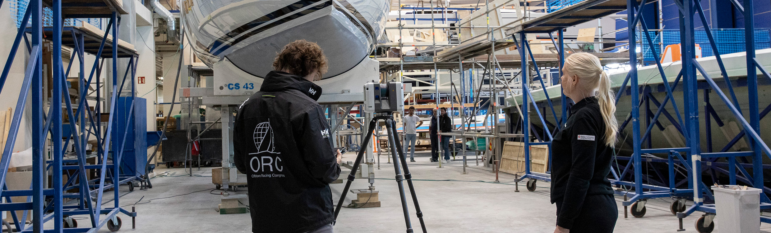 Offshore Racing Congress representative scans the hull of a yacht with a laser scanner